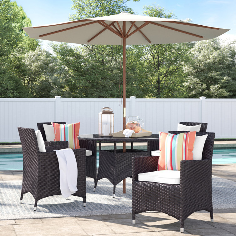 Brentwood Round 5 - Person 47'' Long Dining Set with Cushions and Umbrella