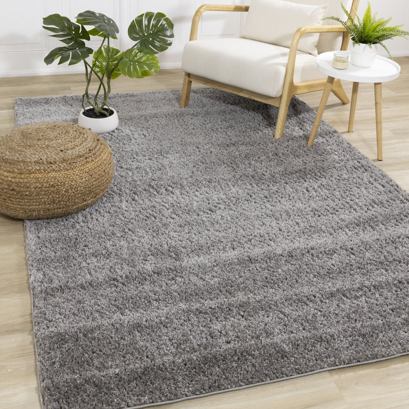 Solid Color Machine Woven Polypropylene Area Rug in Gray Rug Size: Rectangle 6'7" x 9'6"