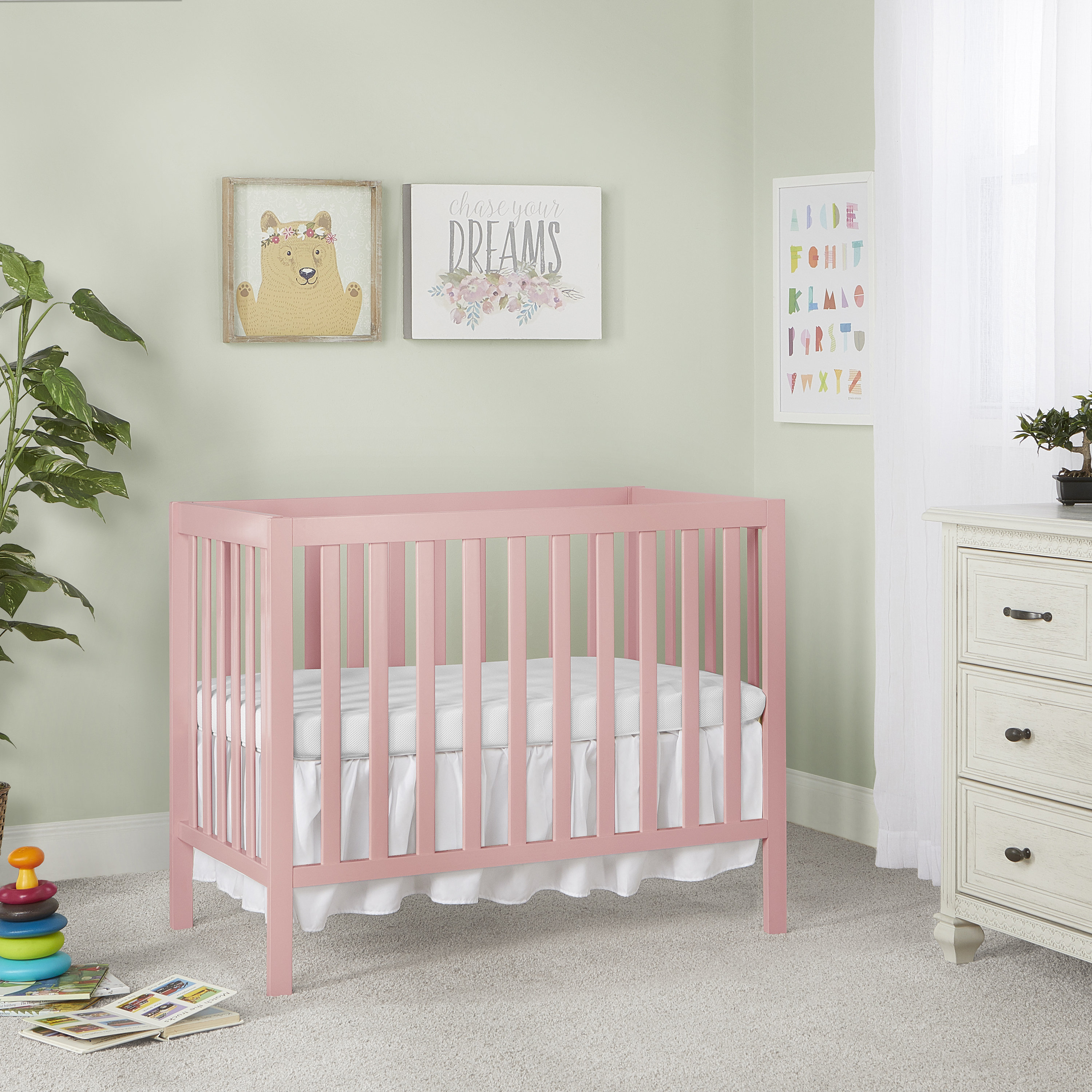 pink mini crib