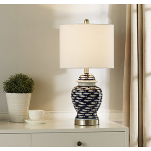 Go to store & view more images Gentry School of Fish Curved 23'' Table Lamp by Rosecliff Heights