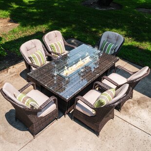 table and chairs with fire pit in the middle