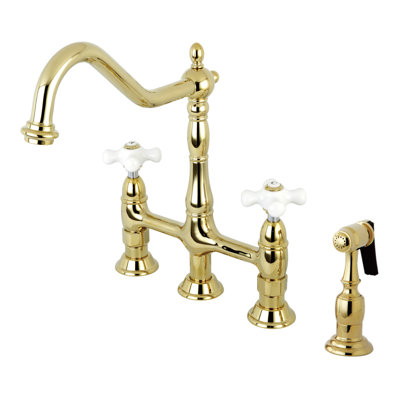 Kingston Brass Heritage Two-Handle 4-Hole Deck Mount Bridge Kitchen Faucet with Brass Side Sprayer