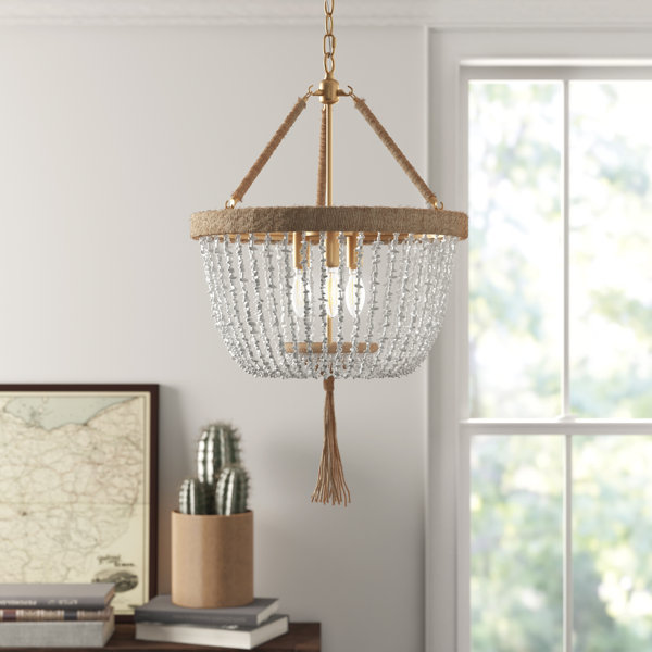 Aw1qolvup Emim Chic living room boasts a gold leaf mirror leaning against a composite fireplace mantle placed before a circular furniture arrangement. https www wayfair com keyword php keyword gold round chandelier