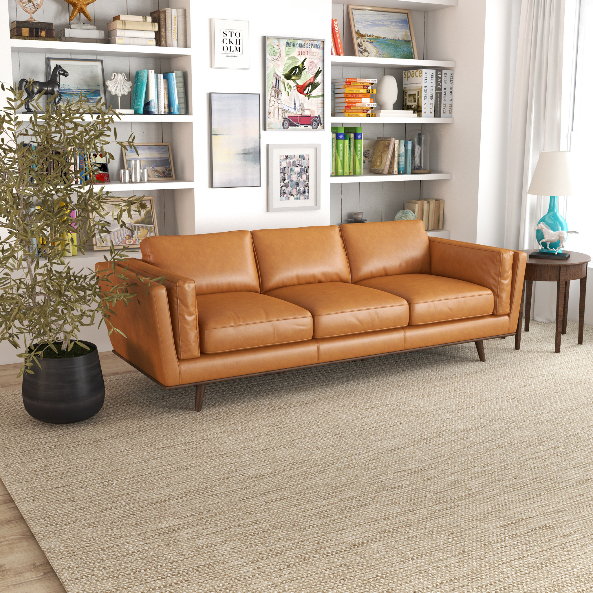 brown leather couch with gray chairs