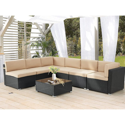 Emilienne 7 Piece Rattan Sectional Seating Group with Cushions