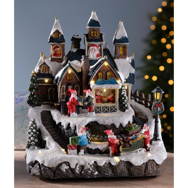 The Seasonal Aisle Pre Lit Led Animated Musical Christmas Santa House Scene With Rotating Carriage Wayfair Co Uk