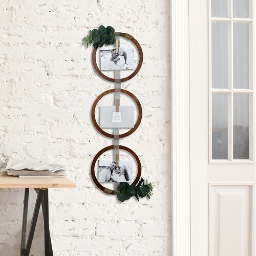 hanging 3 pictures on a wall