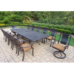Go to store & view more images Vanguard 13 Piece Dining Set with Cushions by Oakland Living