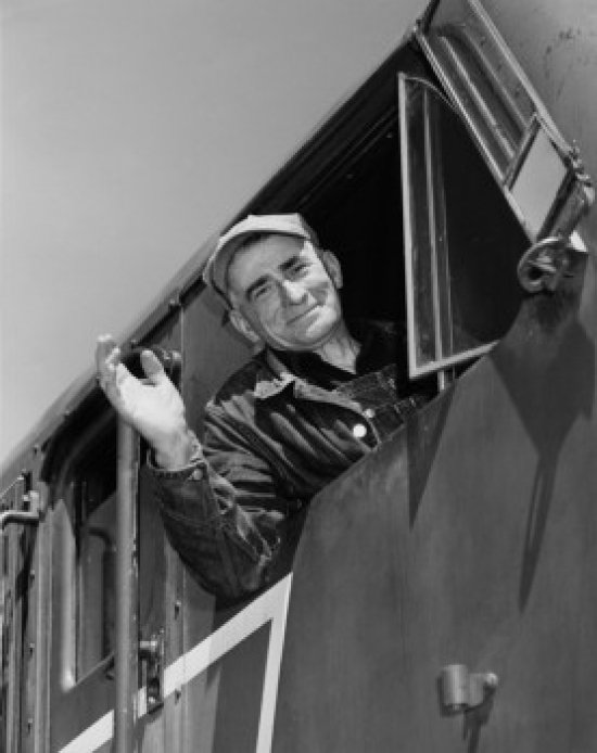 winston-porter-posterazzi-low-angle-view-of-a-train-conductor-smiling
