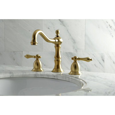 Kingston Brass Heritage Two-Handle 3-Hole Deck Mount Widespread Bathroom Faucet with Brass Pop-Up Drain