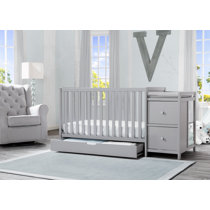 white crib and changing table