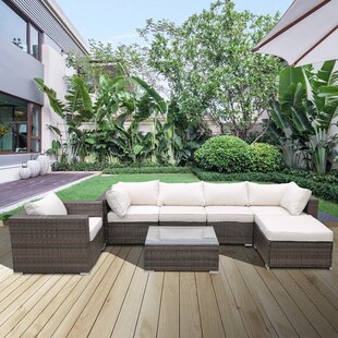 Sharma 7 Piece Rattan Sectional Seating Group with Cushions