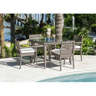 Go to store & view more images Maldives 5 Piece Dining Set with Sunbrella Cushions (Set of 5) by Panama Jack Outdoor