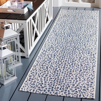 Tyron Animal Print Ivory/Navy Area Rug