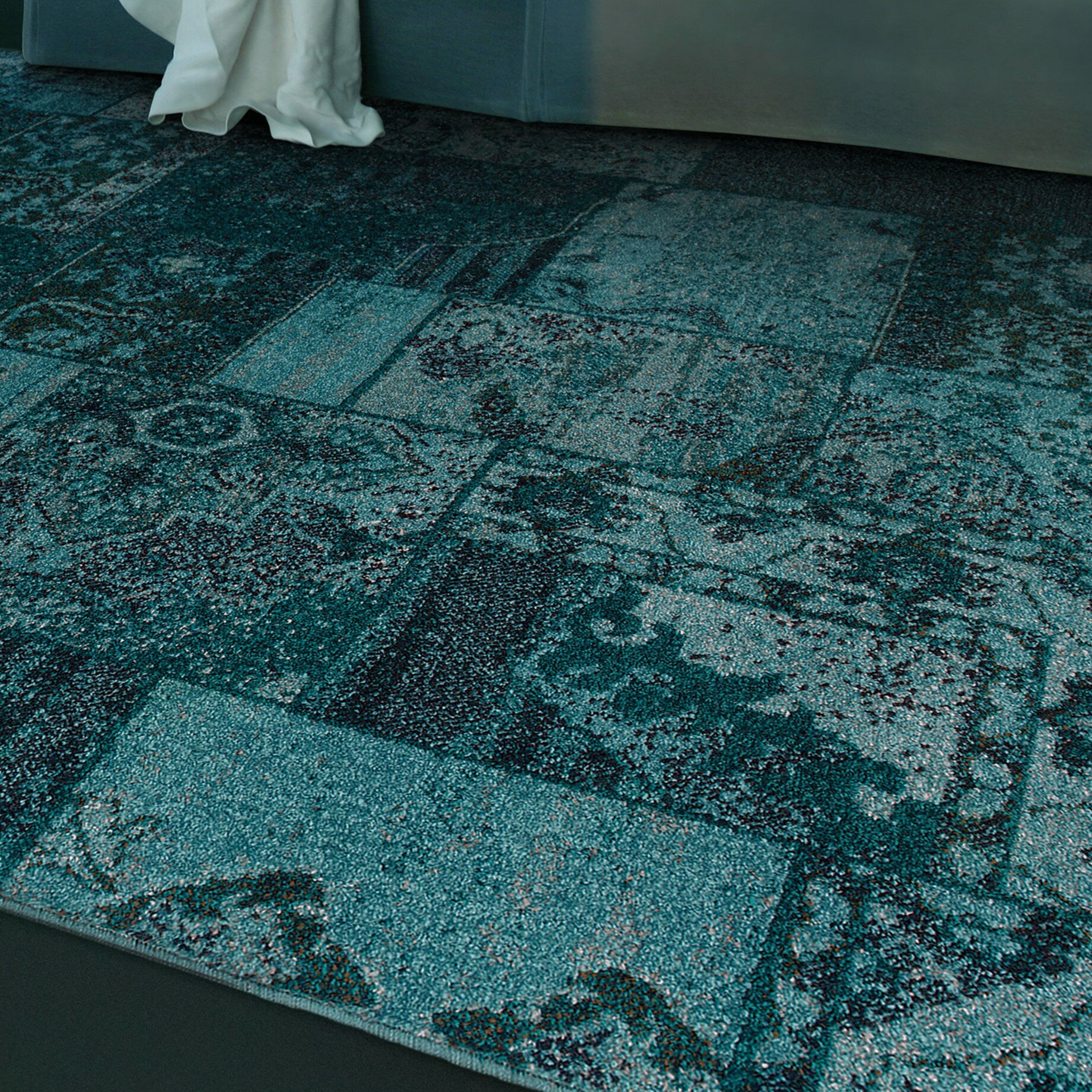 teal colored rugs