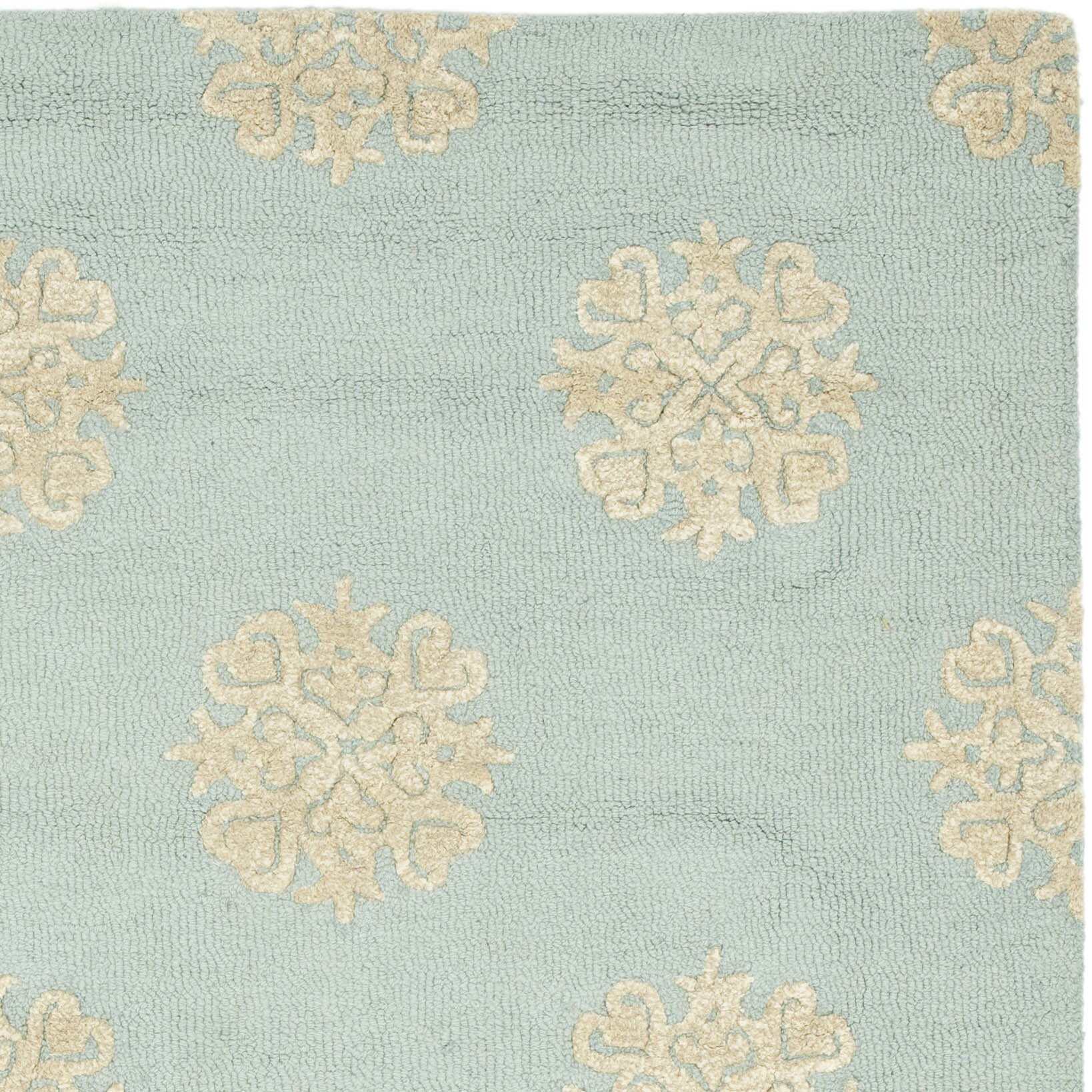 light blue and beige area rug