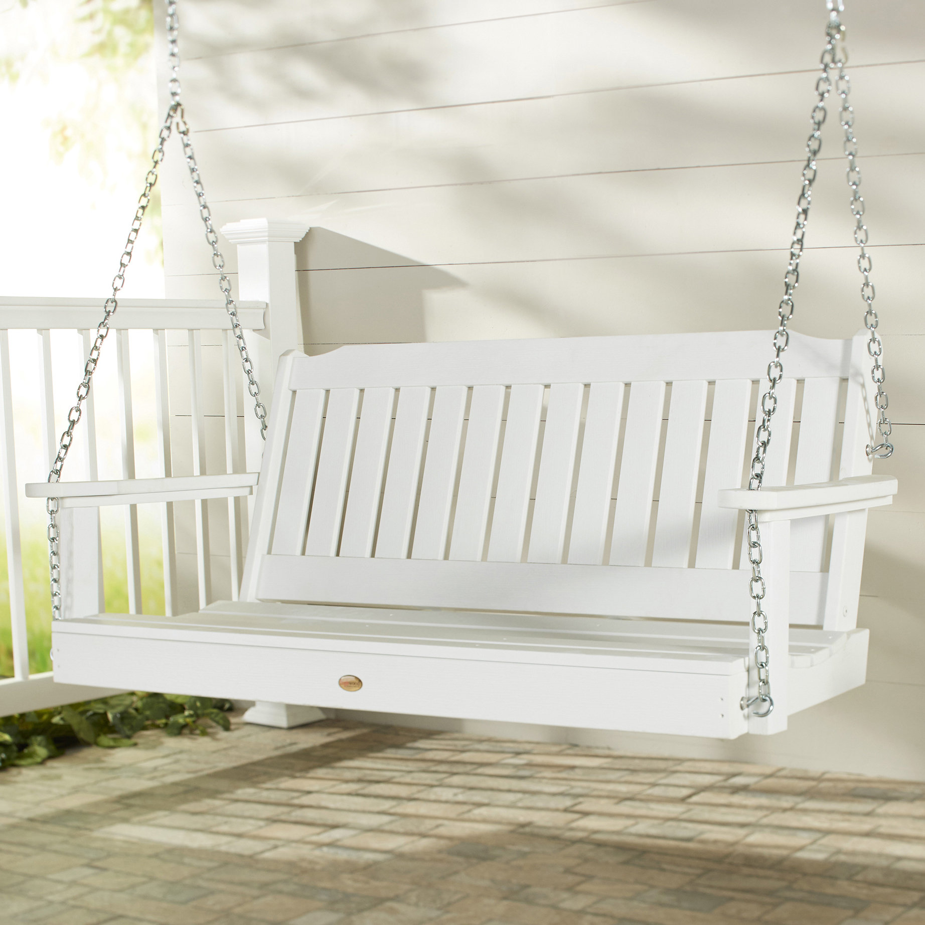 white wooden porch swing