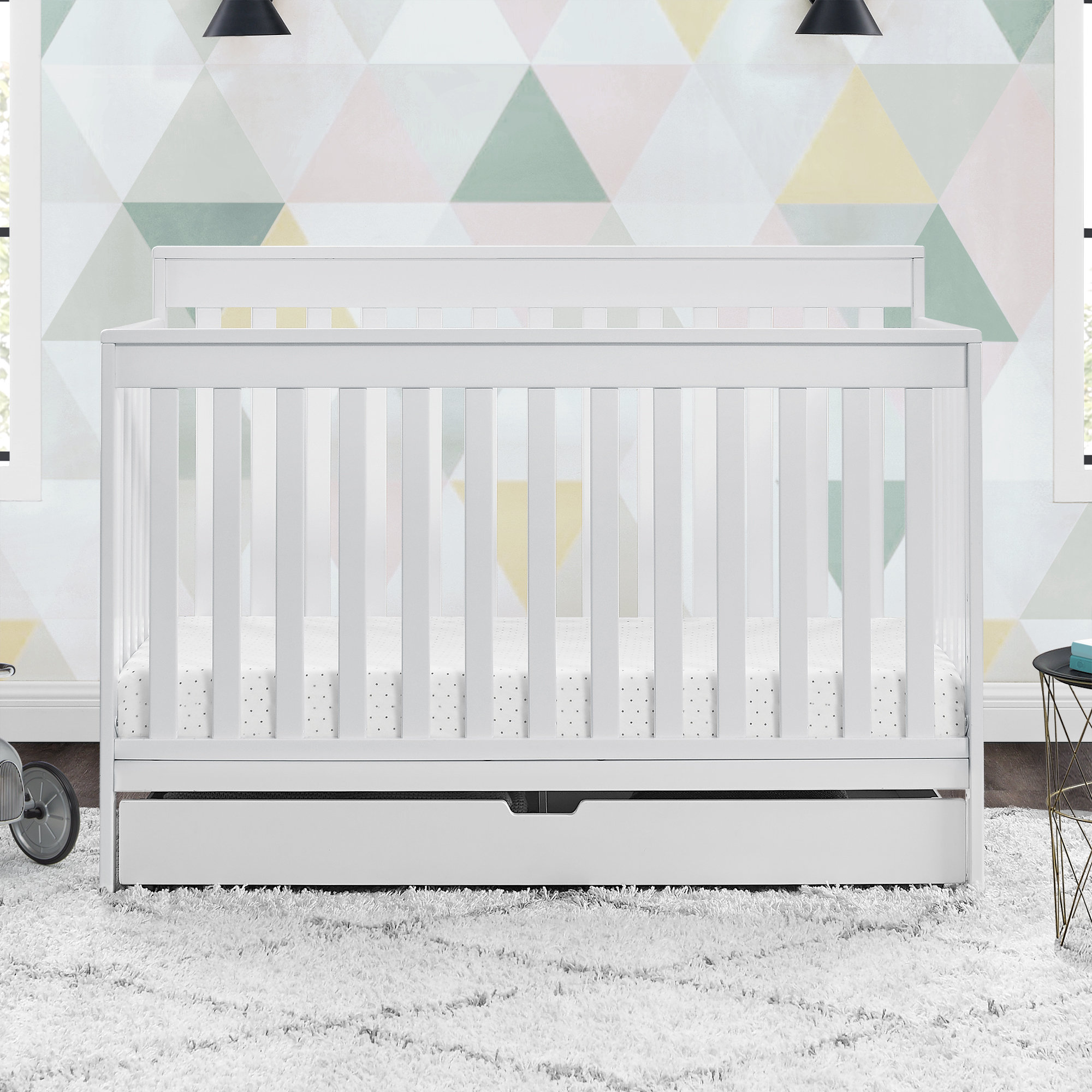 white cot with storage