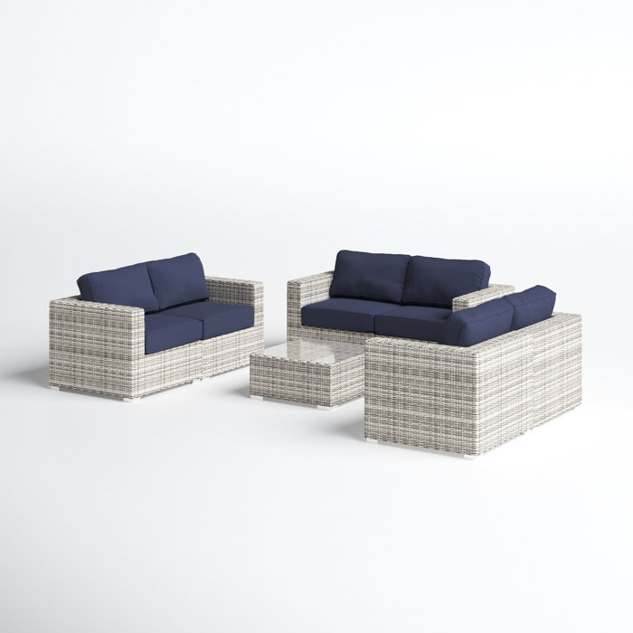 Joss and Main Conner 7 Piece Rattan Sectional Seating Group with Cushions