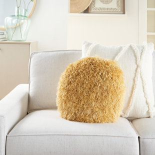 round yellow throw pillow