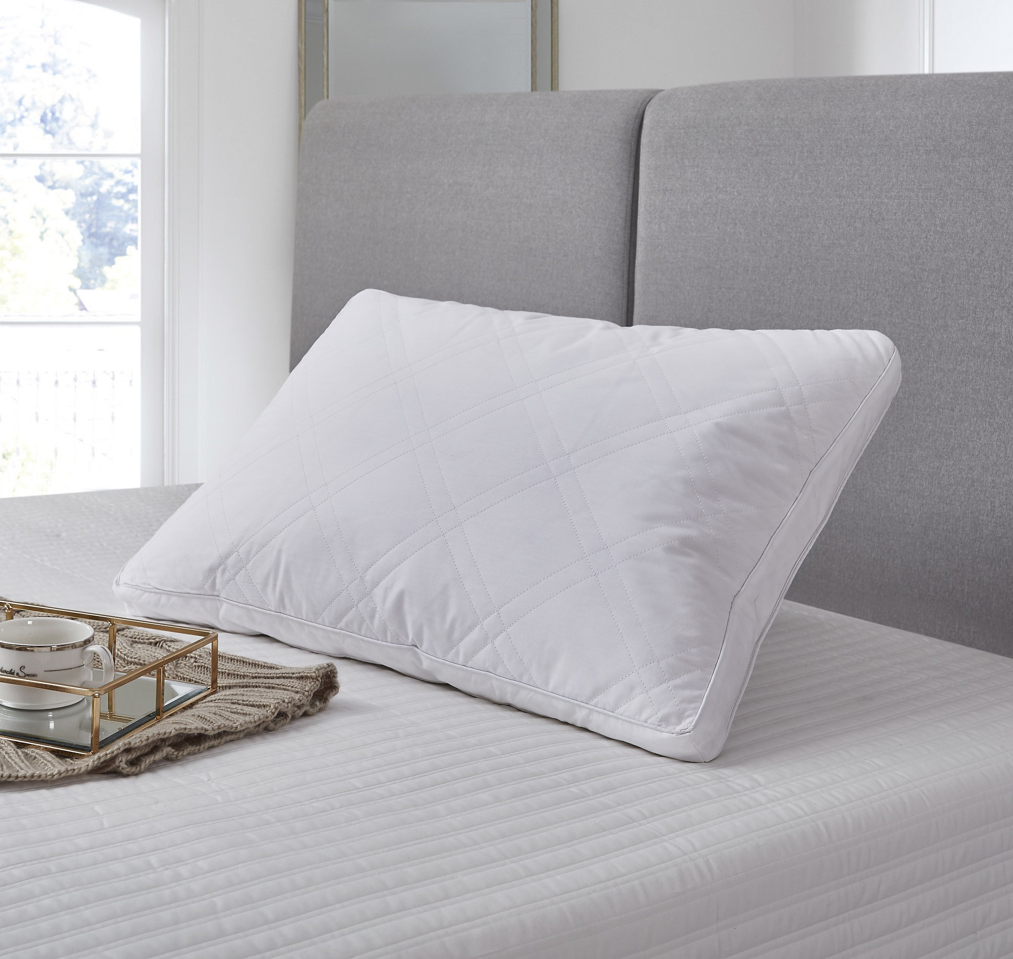 feathers poking out of pillow