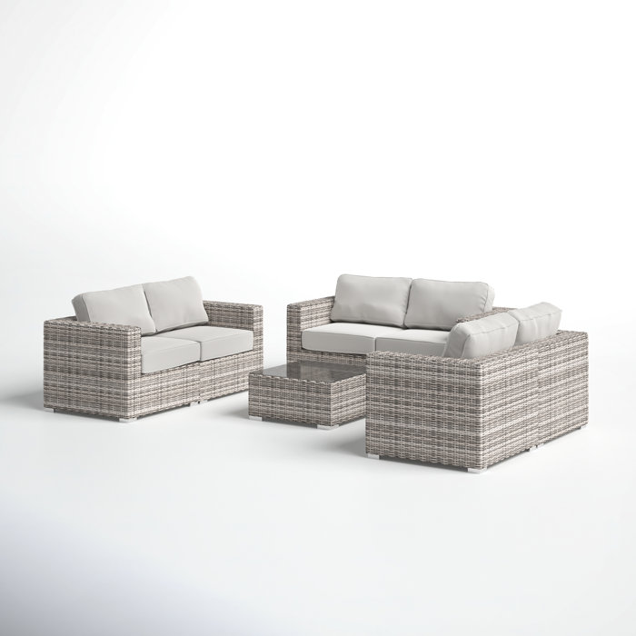 Joss and Main Conner 7 Piece Rattan Sectional Seating Group with Cushions