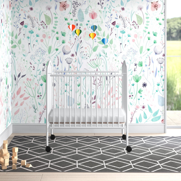 crib with fold down side